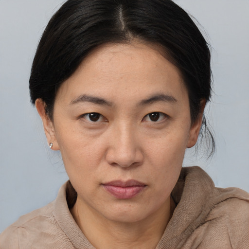 Neutral asian young-adult female with medium  brown hair and brown eyes