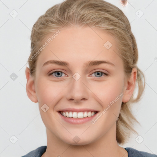 Joyful white young-adult female with medium  brown hair and blue eyes