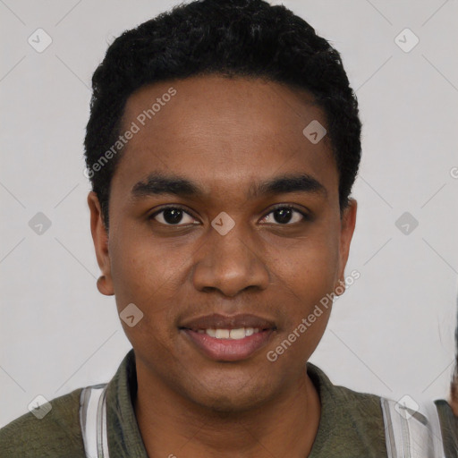 Joyful black young-adult male with short  black hair and brown eyes