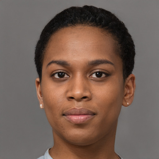Joyful black young-adult female with short  brown hair and brown eyes