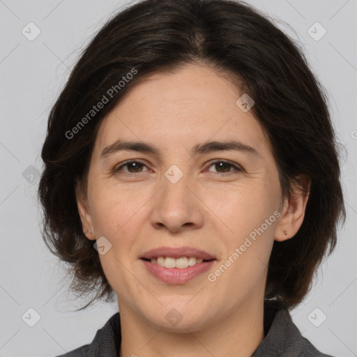 Joyful white adult female with medium  brown hair and brown eyes