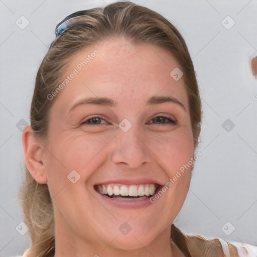 Joyful white young-adult female with medium  brown hair and blue eyes