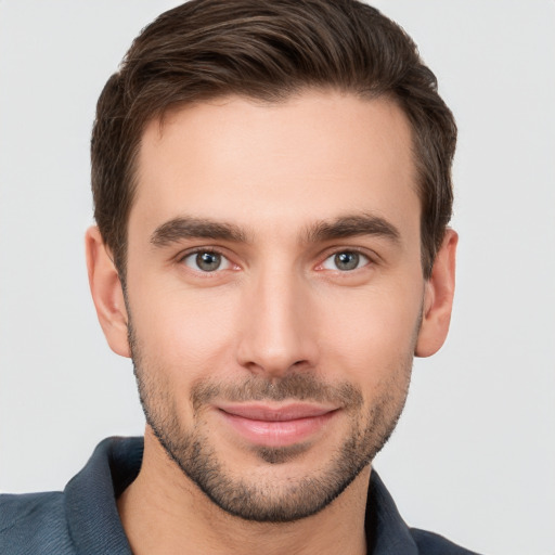 Joyful white young-adult male with short  brown hair and brown eyes