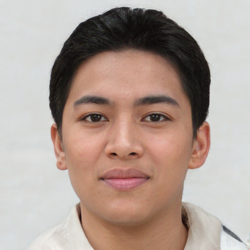 Joyful asian young-adult male with short  black hair and brown eyes