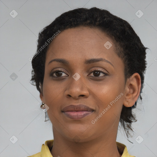 Joyful black young-adult female with short  brown hair and brown eyes