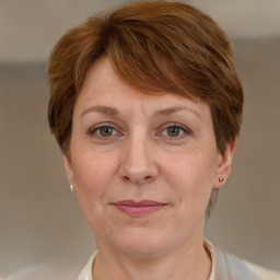 Joyful white adult female with short  brown hair and grey eyes