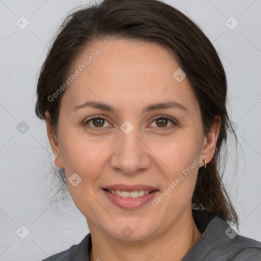 Joyful white adult female with medium  brown hair and brown eyes