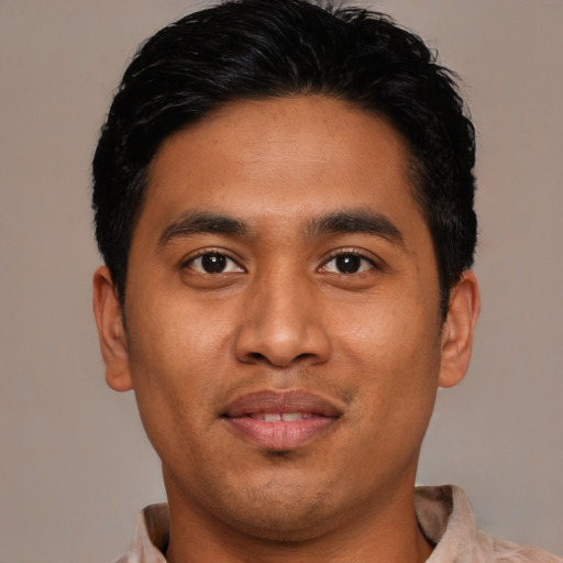 Joyful asian young-adult male with short  black hair and brown eyes