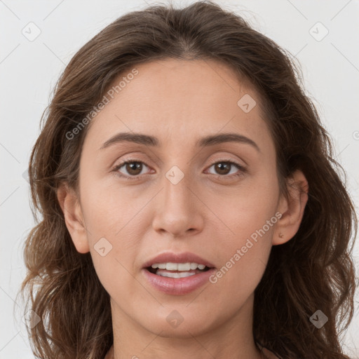 Joyful white adult female with long  brown hair and brown eyes