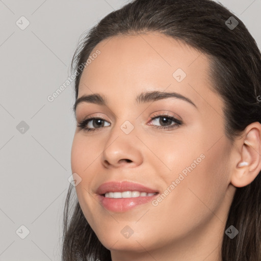 Joyful white young-adult female with long  brown hair and brown eyes