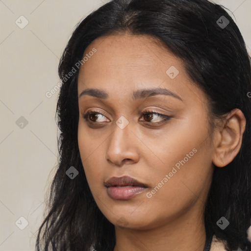 Joyful asian young-adult female with long  brown hair and brown eyes