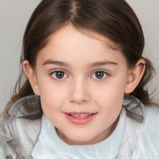 Joyful white child female with medium  brown hair and brown eyes