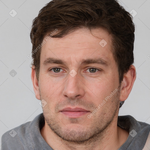 Joyful white adult male with short  brown hair and grey eyes