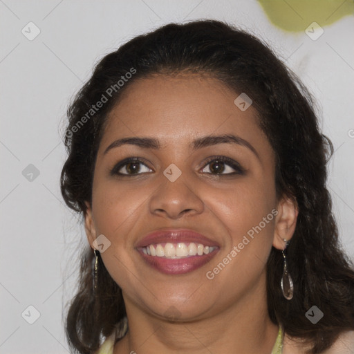 Joyful black young-adult female with long  brown hair and brown eyes