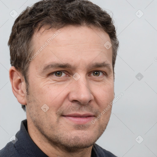 Joyful white adult male with short  brown hair and grey eyes