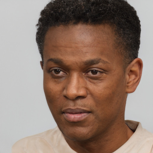 Neutral black adult male with short  brown hair and brown eyes