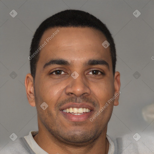 Joyful black young-adult male with short  brown hair and brown eyes