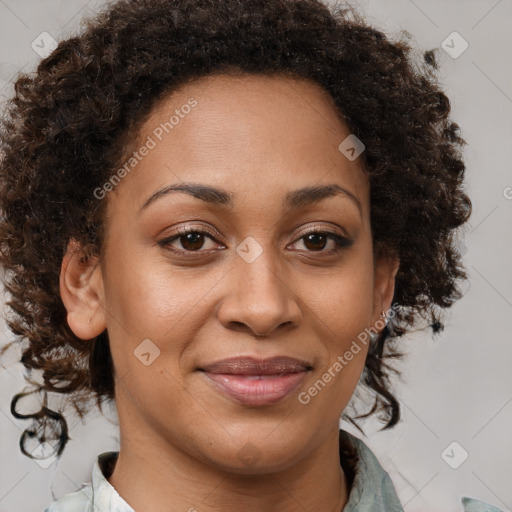 Joyful black adult female with medium  brown hair and brown eyes