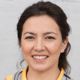 Joyful white young-adult female with medium  brown hair and brown eyes