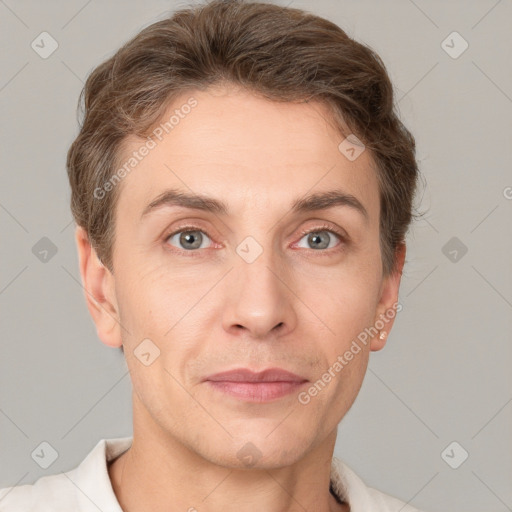 Joyful white adult male with short  brown hair and grey eyes