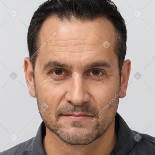 Joyful white adult male with short  brown hair and brown eyes