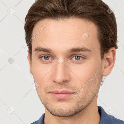 Neutral white young-adult male with short  brown hair and brown eyes