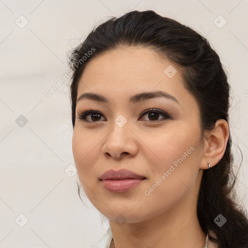 Joyful latino young-adult female with long  brown hair and brown eyes