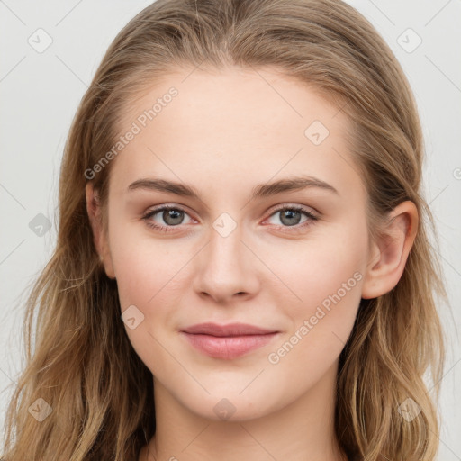 Joyful white young-adult female with long  brown hair and blue eyes