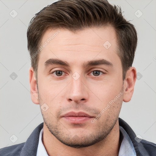 Neutral white young-adult male with short  brown hair and brown eyes