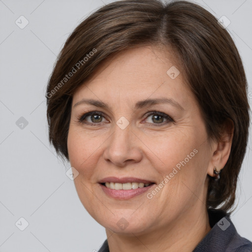 Joyful white adult female with medium  brown hair and brown eyes