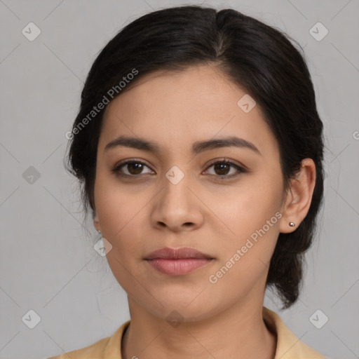 Joyful latino young-adult female with medium  brown hair and brown eyes