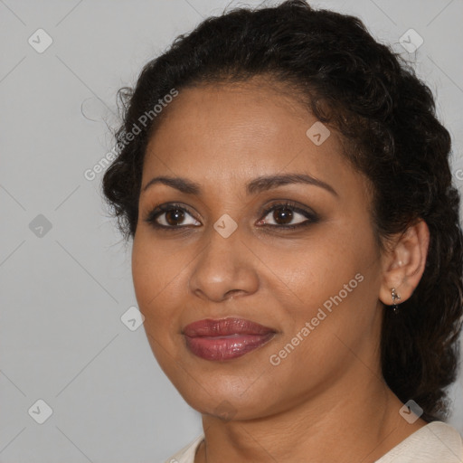 Joyful black young-adult female with medium  brown hair and brown eyes