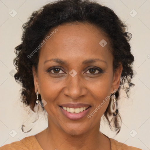 Joyful black adult female with medium  brown hair and brown eyes