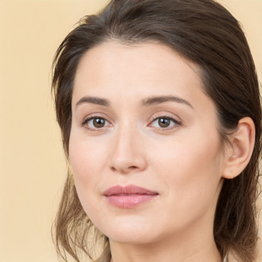 Joyful white young-adult female with medium  brown hair and brown eyes