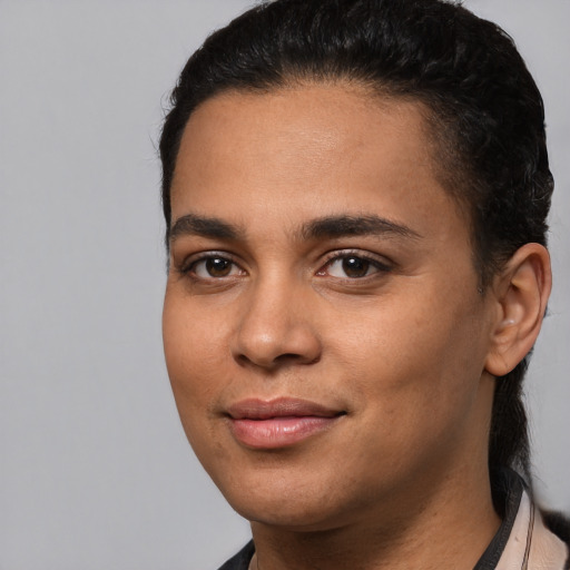 Joyful latino young-adult female with short  brown hair and brown eyes