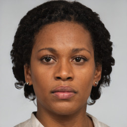 Neutral black young-adult female with short  brown hair and brown eyes