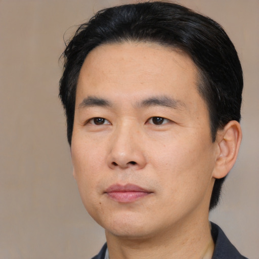 Neutral asian adult male with short  black hair and brown eyes