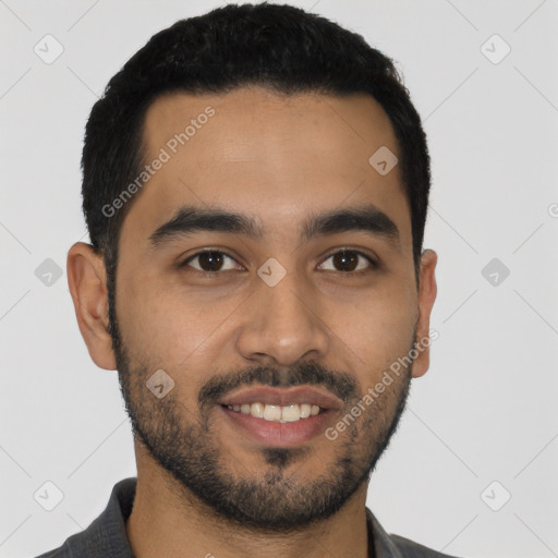 Joyful latino young-adult male with short  black hair and brown eyes