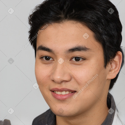 Joyful latino young-adult male with short  brown hair and brown eyes