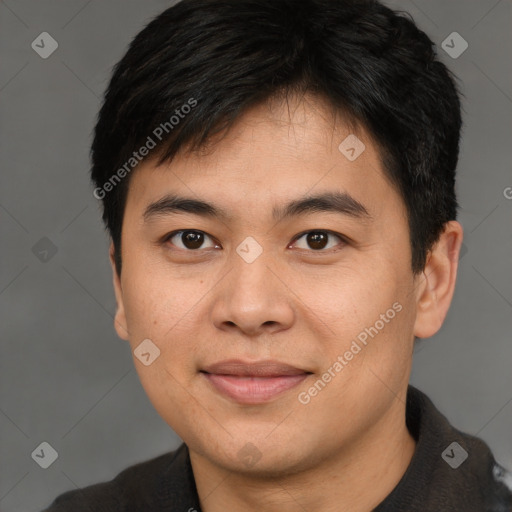 Joyful asian young-adult male with short  brown hair and brown eyes
