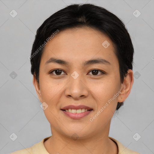 Joyful asian young-adult female with short  brown hair and brown eyes