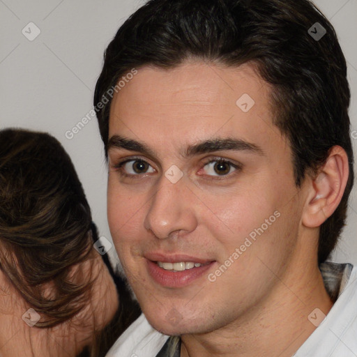 Joyful white young-adult male with medium  brown hair and brown eyes