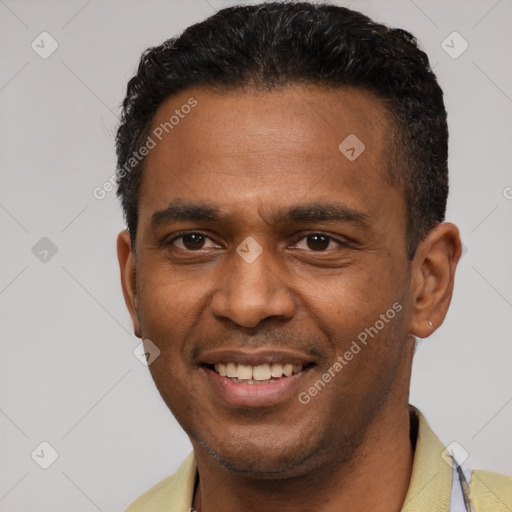 Joyful latino young-adult male with short  black hair and brown eyes