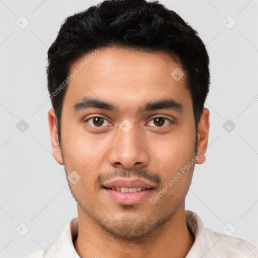 Joyful white young-adult male with short  black hair and brown eyes