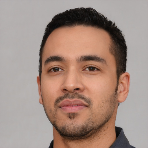 Neutral latino young-adult male with short  black hair and brown eyes