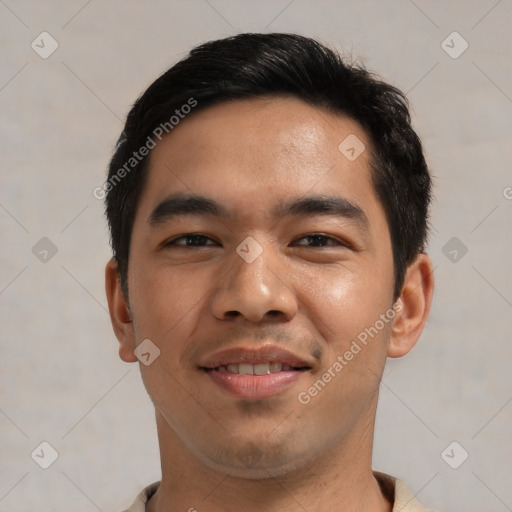 Joyful asian young-adult male with short  black hair and brown eyes