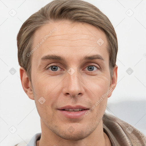 Joyful white adult male with short  brown hair and grey eyes