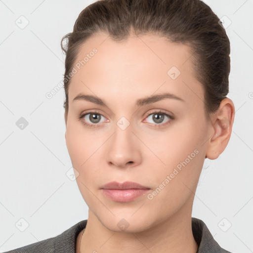 Neutral white young-adult female with short  brown hair and brown eyes