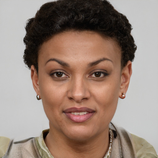 Joyful latino young-adult female with short  brown hair and brown eyes