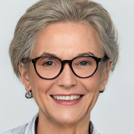 Joyful white middle-aged female with medium  brown hair and blue eyes